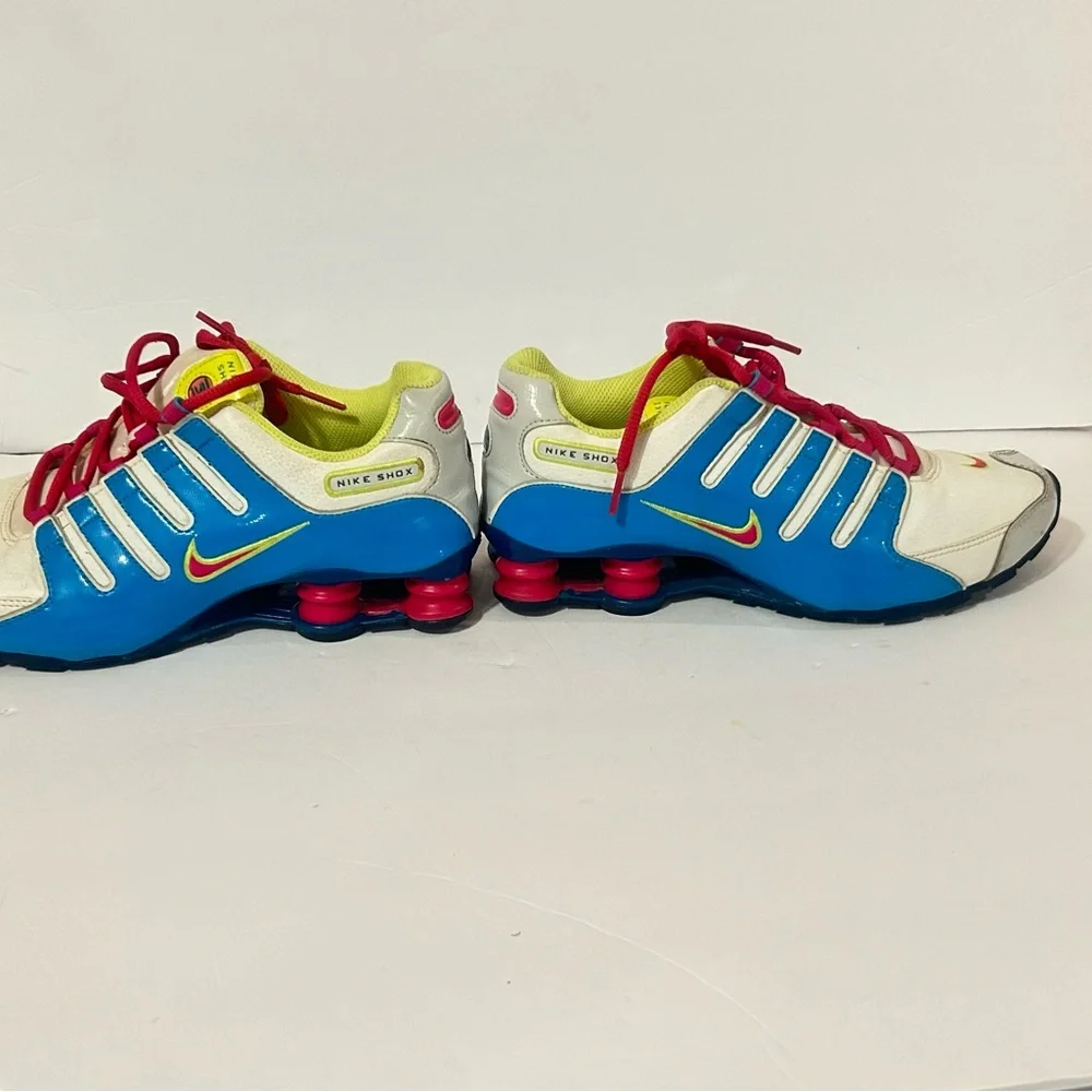 Nike Kids Shox Sneakers in White with Blue, Pink & Neon Yellow Accents